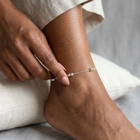Thumbnail for Silver Bead Anklet showcasing polished silver beads on a delicate chain, perfect for summer vibes by Brother & Sisters.