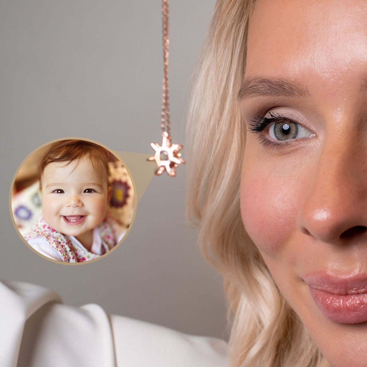 Close-up of a woman wearing a Sun Photo Necklace by Brother & Sisters, featuring a smiling baby photo illuminated by light.