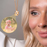 Thumbnail for Close-up of a woman wearing a Sun Photo Necklace, showcasing a cherished photo illuminated within the pendant, by Brother & Sisters.