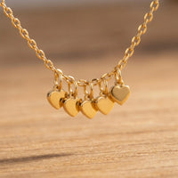 Thumbnail for Tiny Heart Drop Anklet with five delicate heart drops, ultra-dainty gold chain from Brother & Sisters brand.