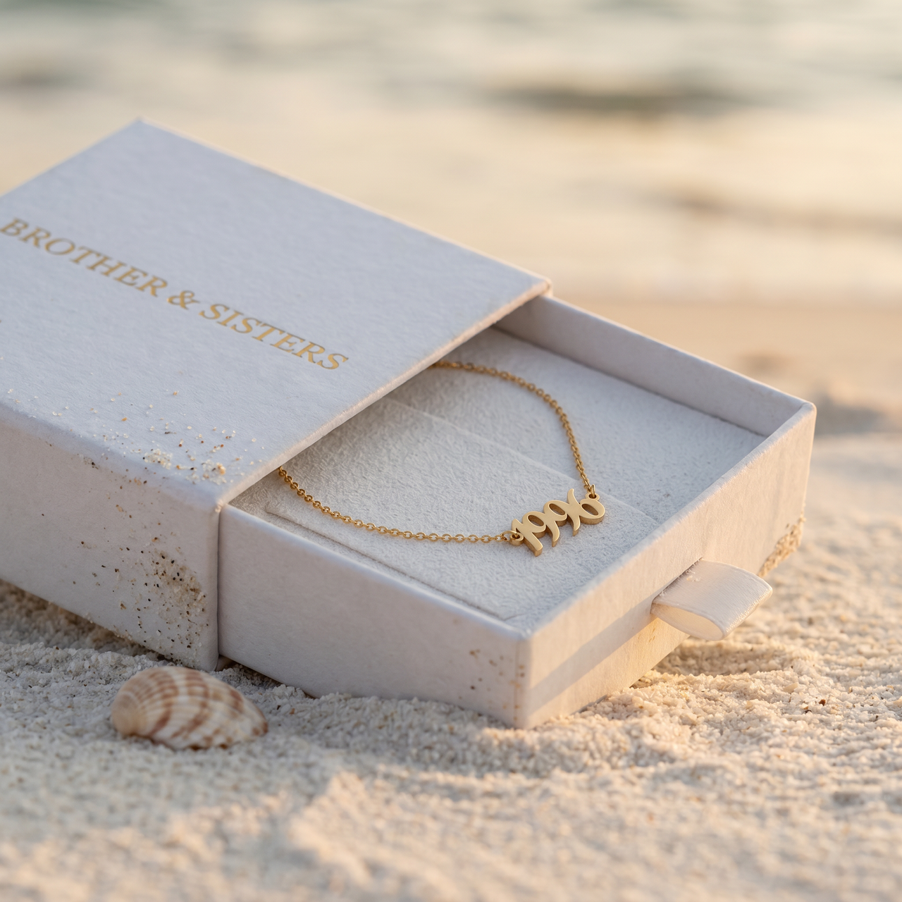 Year Number Anklet in Brother & Sisters gift box on beach